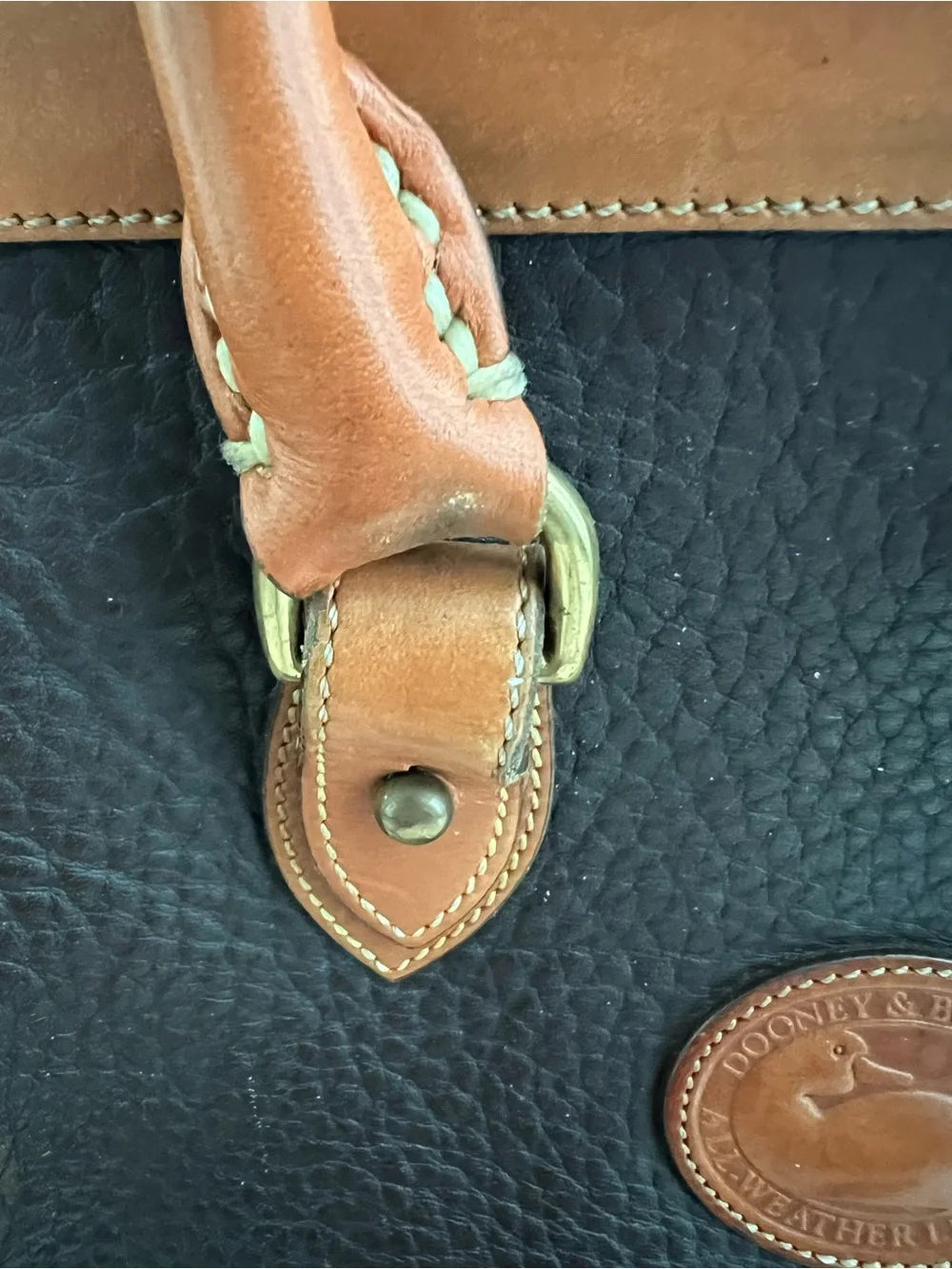 Dooney & Bourke VINTAGE black pebbled Leather satchel with British tan trim.